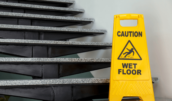 Wet floor sign on stairs