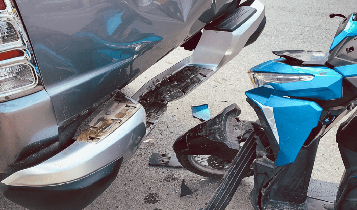 A motorcycle hit in cars