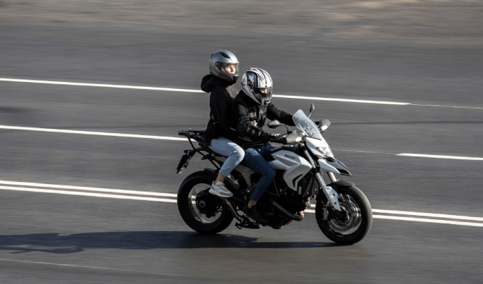 Couple riding in a motorcycle