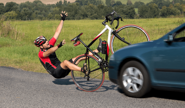 A car and a bicycle collide each other